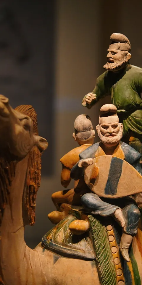 Sculpted figures in a dimly lit interior