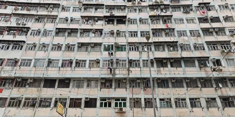 A facade filled with windows and balconies