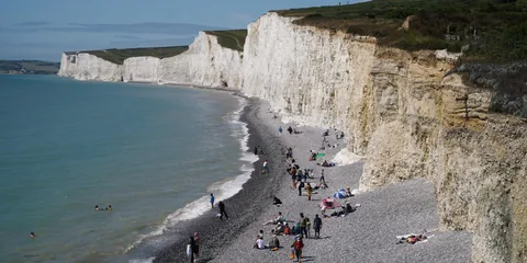 White chalk cliffs beside a blue sea