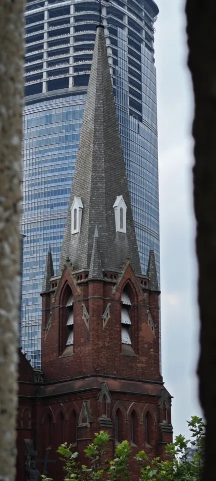 A church spire among city towers