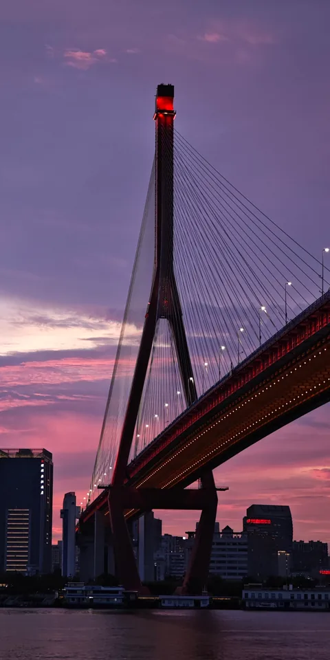 A bridge against a violet evening sky