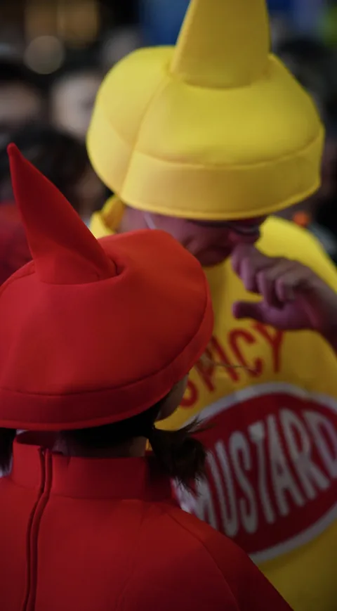 A yellow hat and red costume