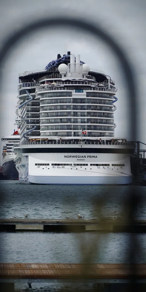 A cruise ship seen through a railing