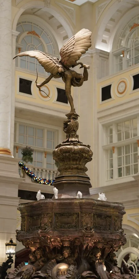 A winged statue inside a grand hall